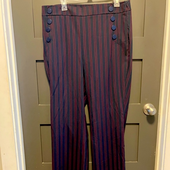 “Julie” navy trousers with red pin stripes and pocket button accents. - Picture 1 of 5